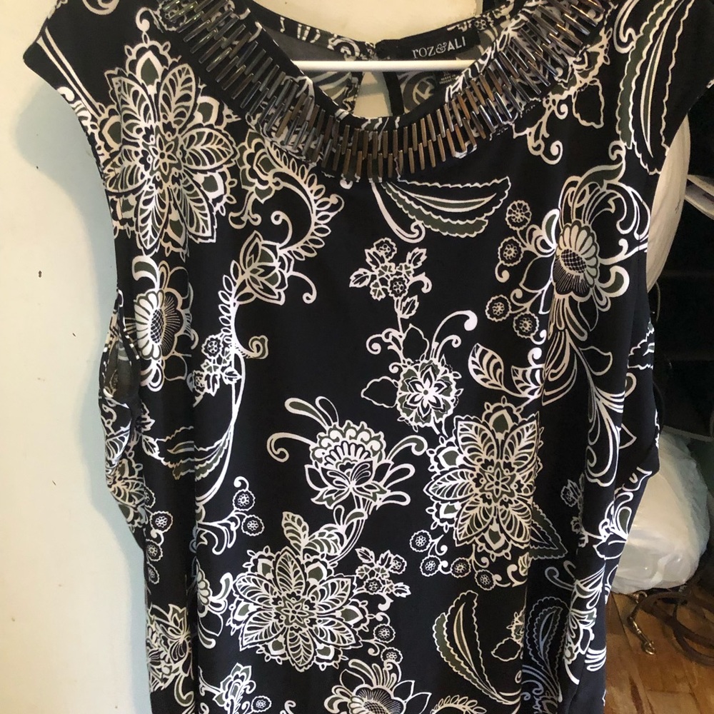 Sleeveless blouse with silver beads at neckline